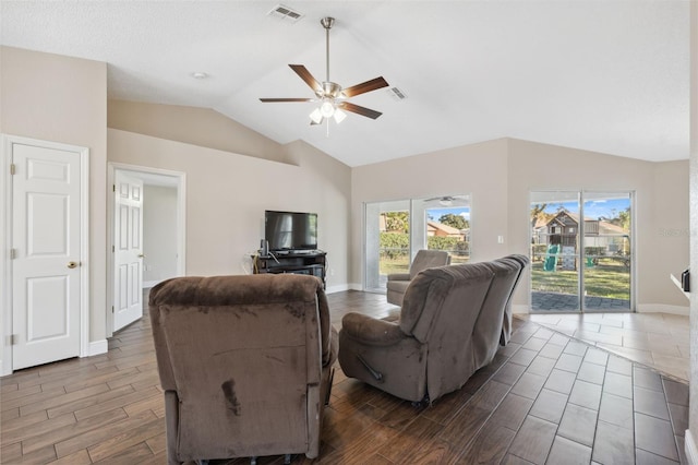 living room featuring ceiling fan and lofted ceiling