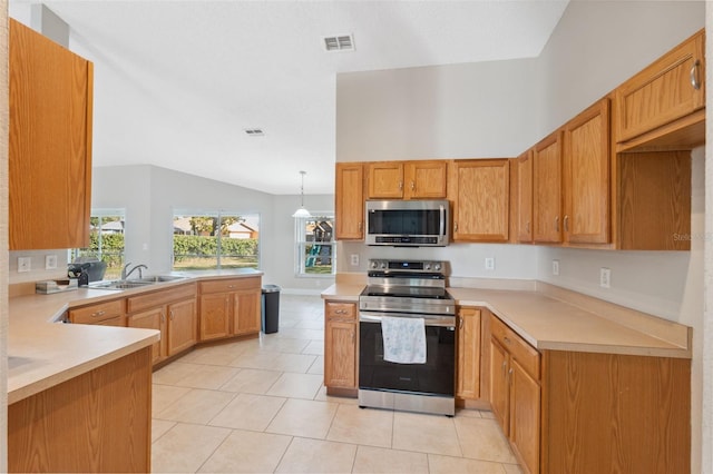 kitchen featuring stainless steel appliances, kitchen peninsula, vaulted ceiling, decorative light fixtures, and light tile patterned floors