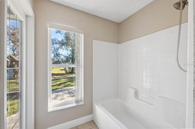 bathroom featuring tile patterned floors and plenty of natural light