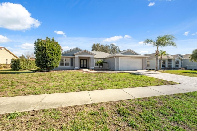 ranch-style house featuring a front lawn and a garage