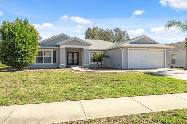 single story home featuring french doors, a front lawn, and a garage