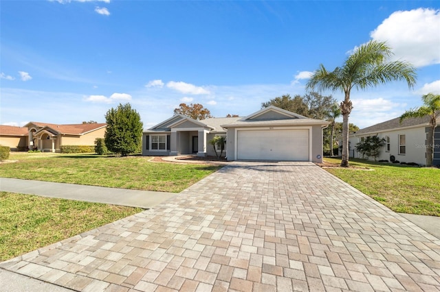 ranch-style house featuring a front lawn and a garage