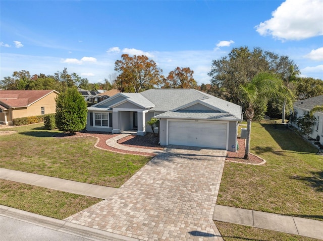 single story home featuring a garage and a front yard