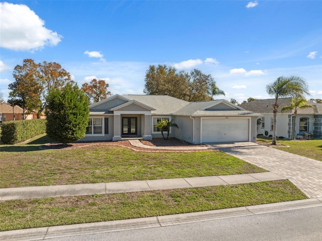 ranch-style house with a garage and a front yard