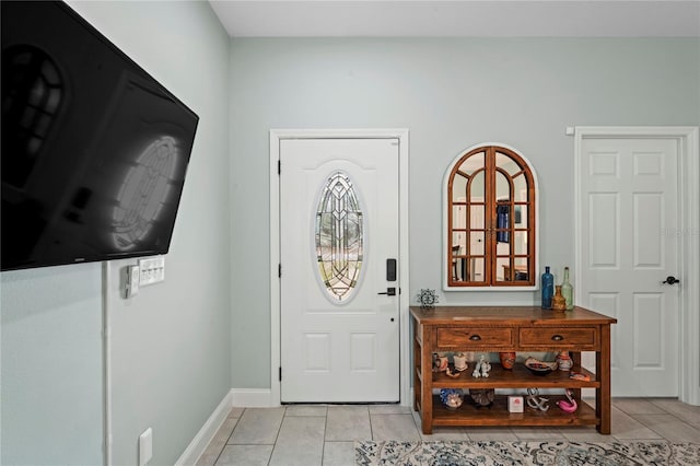 entrance foyer with light tile patterned floors