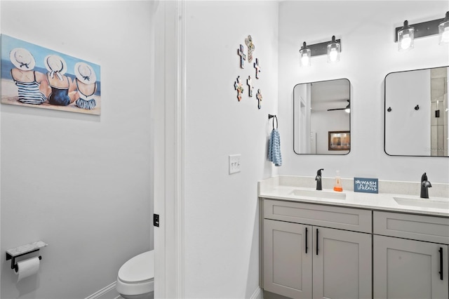 bathroom with vanity and toilet