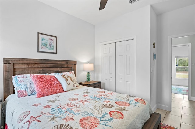 tiled bedroom with a closet and ceiling fan