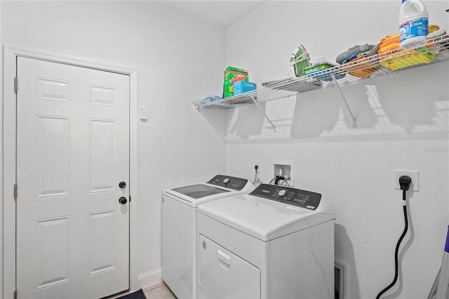 laundry room with independent washer and dryer