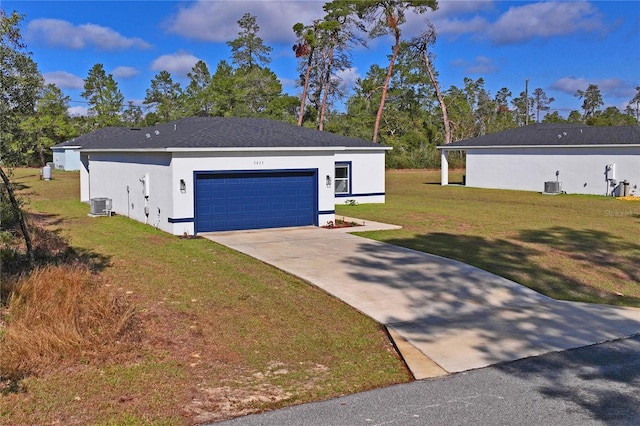 view of front of property with a front yard, a garage, and cooling unit