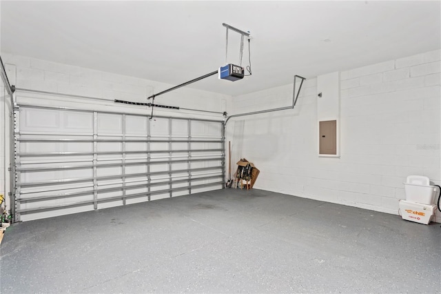 garage featuring a garage door opener and electric panel