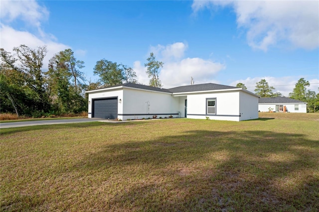 ranch-style house with a front lawn and a garage