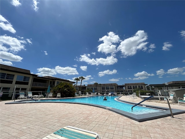 view of swimming pool with a patio