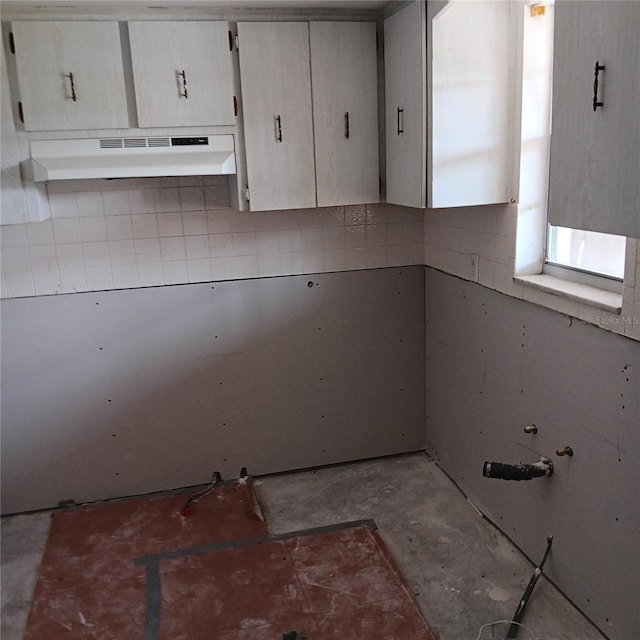 4829 Onyx Ln Unit 102, New Port Richey, FL 34652 - kitchen featuring under cabinet range hood and concrete flooring