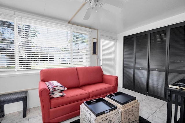 tiled living room featuring ceiling fan