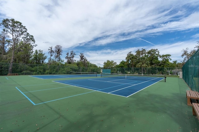 view of tennis court featuring basketball court