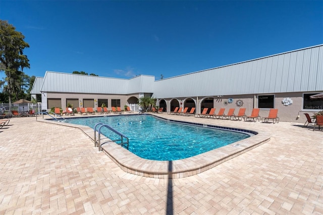 view of pool featuring a patio