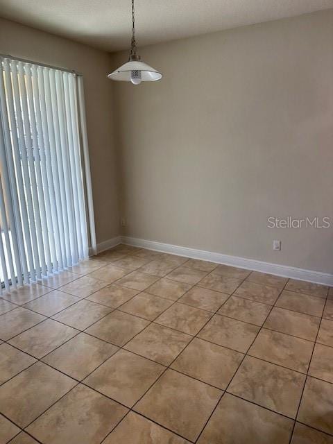 view of tiled spare room