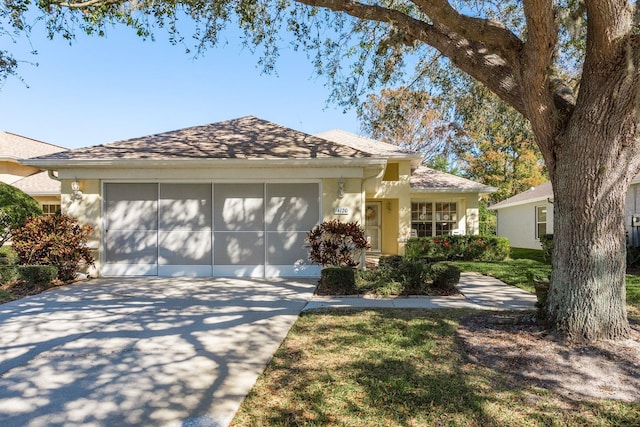 single story home with a garage