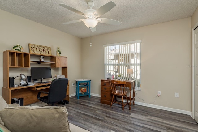 home office with a textured ceiling, ceiling fan, and dark wood-type flooring