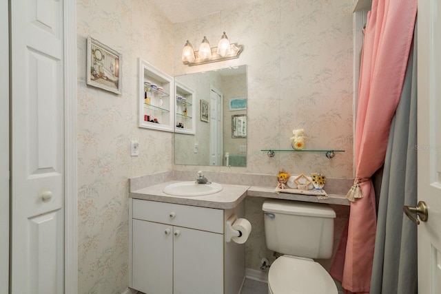 bathroom with vanity and toilet