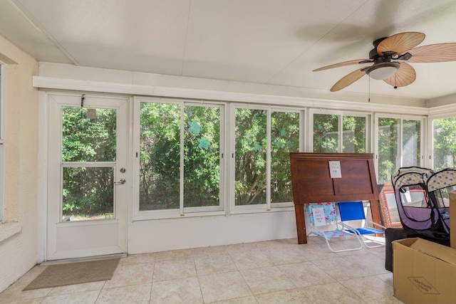 sunroom / solarium with ceiling fan and a healthy amount of sunlight