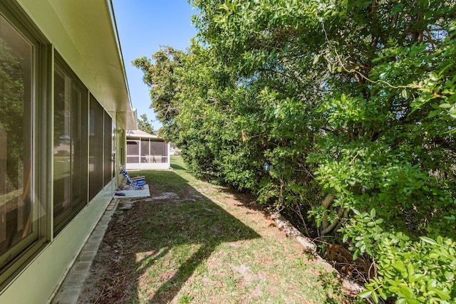 view of yard with a sunroom