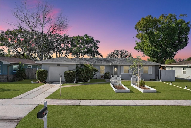 ranch-style home featuring a lawn