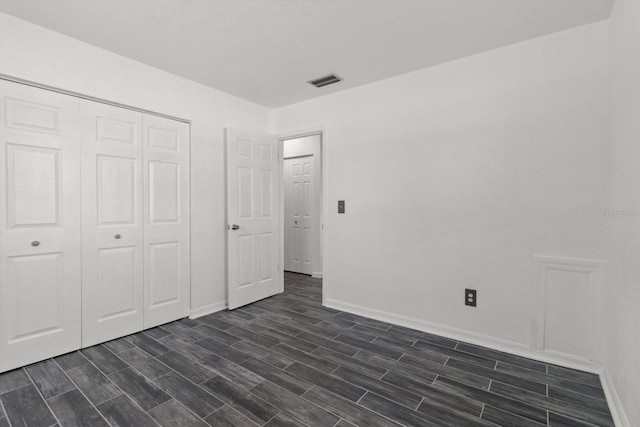 unfurnished bedroom featuring a closet