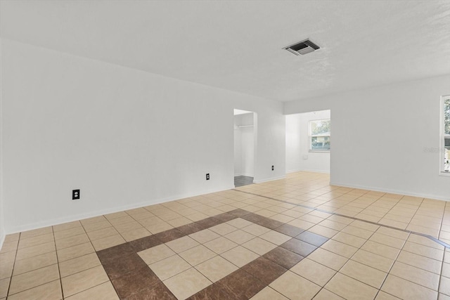 empty room featuring light tile patterned flooring