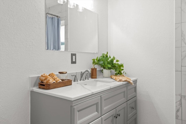 bathroom with vanity and walk in shower