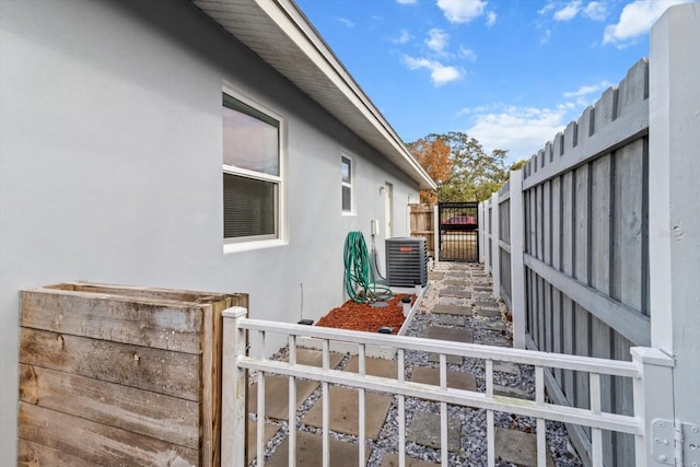 view of side of property featuring central AC unit