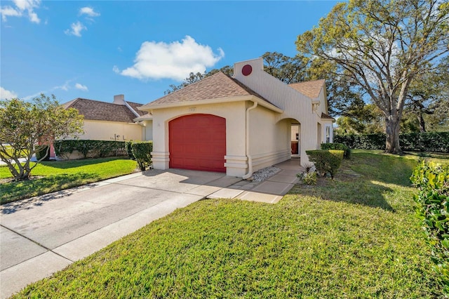 view of front facade with a front lawn and a garage