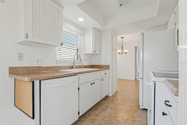 kitchen featuring stove, sink, pendant lighting, dishwasher, and white cabinetry