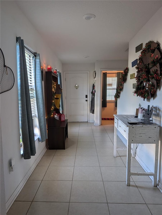 tiled entrance foyer with a wealth of natural light