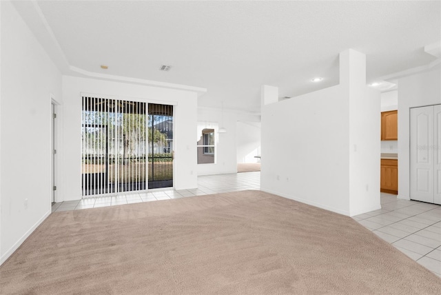 unfurnished living room with light tile patterned floors