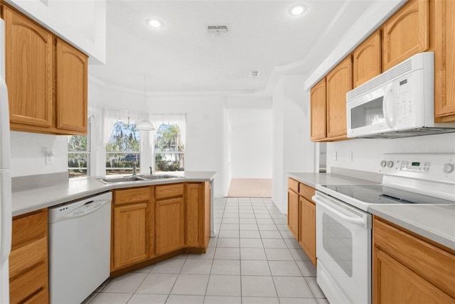 kitchen with kitchen peninsula, ornamental molding, white appliances, sink, and light tile patterned flooring