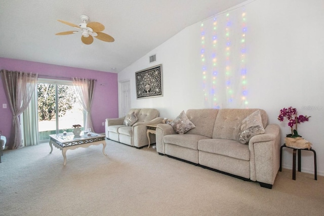 carpeted living room featuring ceiling fan and vaulted ceiling