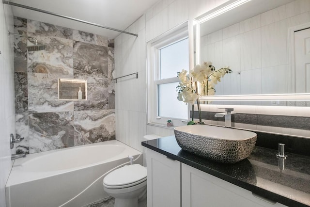 full bathroom featuring shower / tub combination, tile walls, and toilet