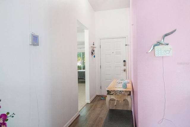 corridor featuring hardwood / wood-style floors