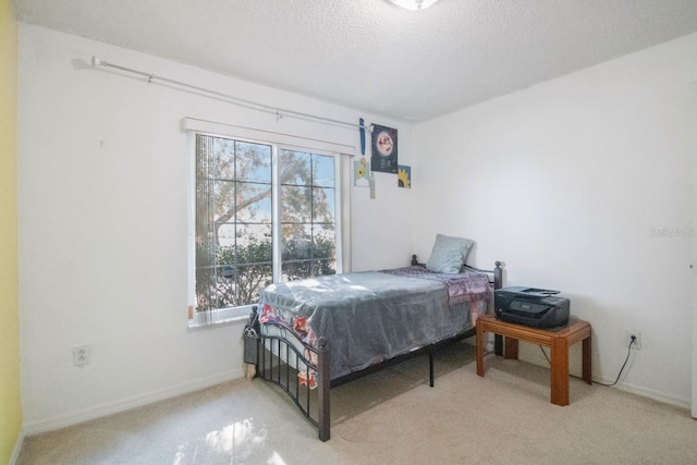 carpeted bedroom with a textured ceiling