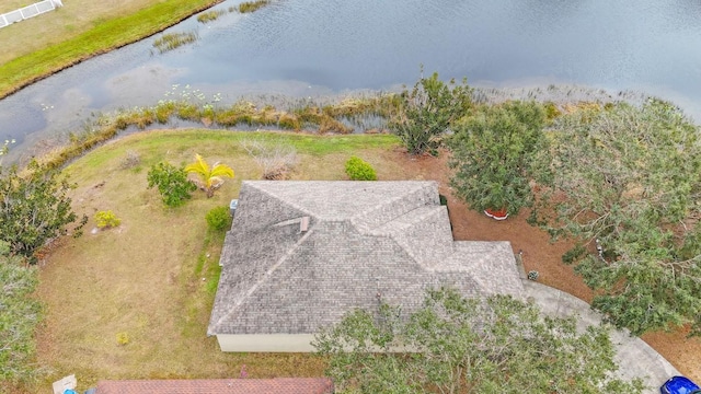 birds eye view of property with a water view