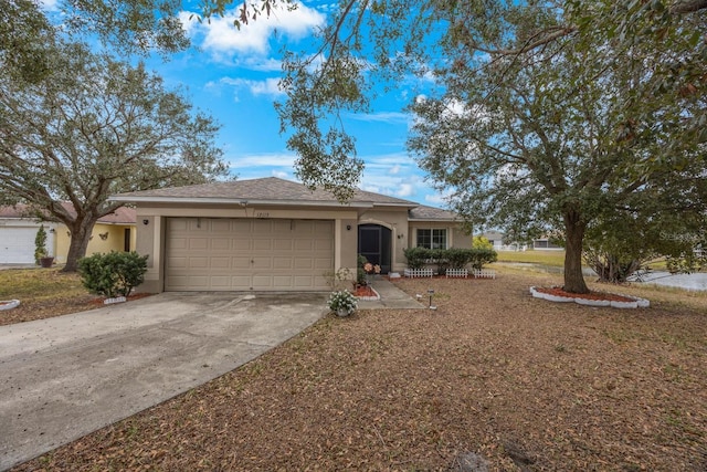 ranch-style house featuring a garage