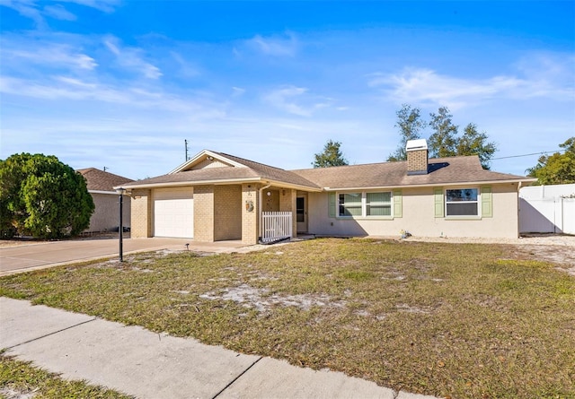 single story home with a front lawn and a garage