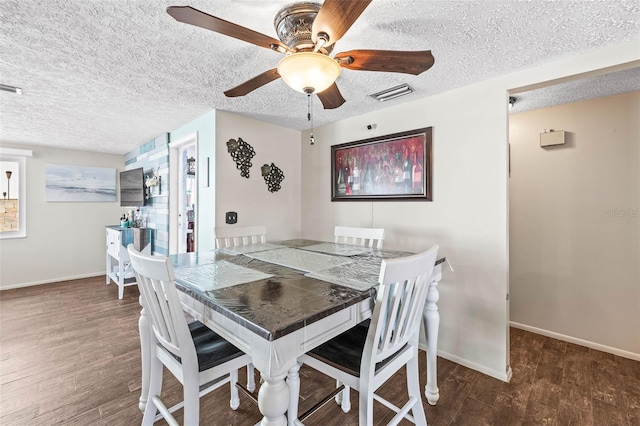 dining space with a textured ceiling, dark hardwood / wood-style flooring, and ceiling fan