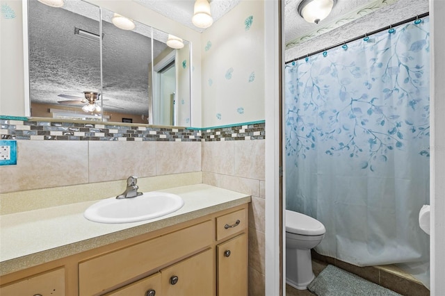 bathroom featuring walk in shower, a textured ceiling, toilet, vanity, and tile walls