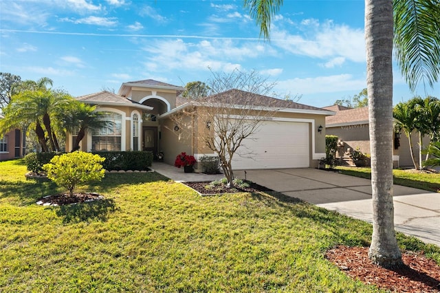 view of front of house featuring a garage and a front lawn