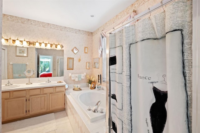 bathroom with tiled tub, vanity, and tile patterned floors