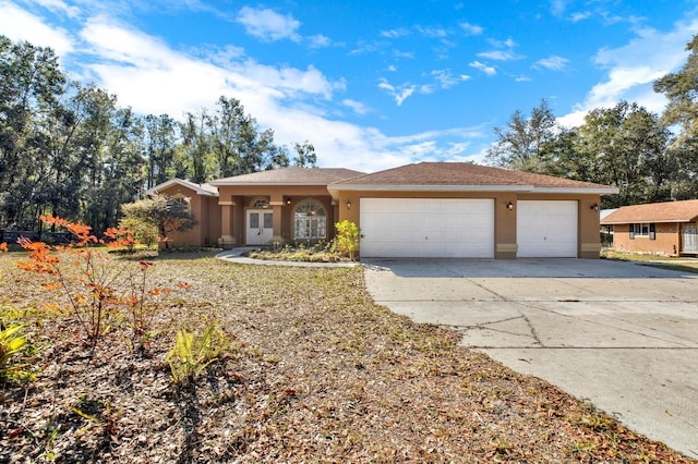 ranch-style house featuring a garage