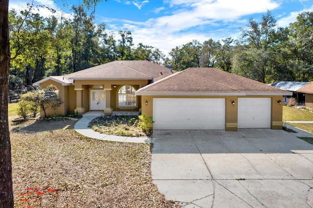 single story home featuring a garage