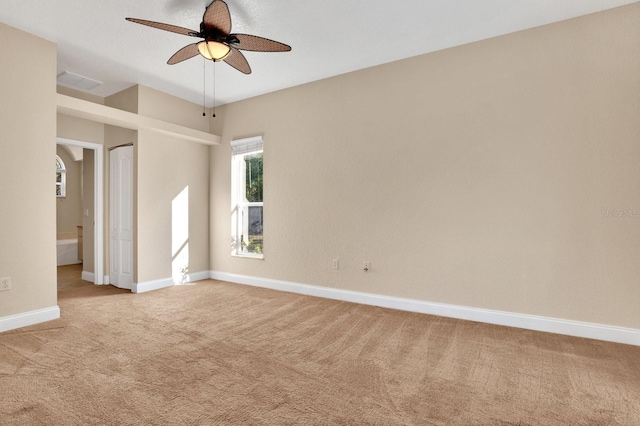 carpeted empty room featuring ceiling fan